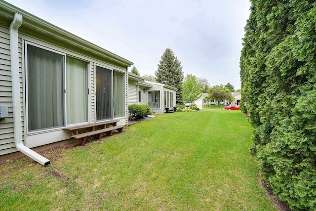 741 Kensington Sq, Stoughton, WI 53589 - view of green lawn featuring entry steps