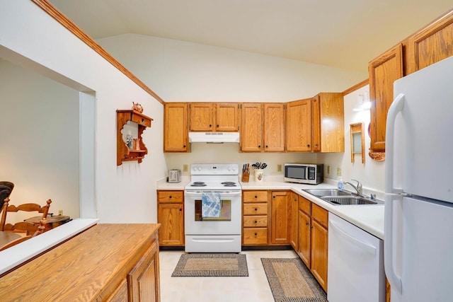 741 Kensington Sq, Stoughton, WI 53589 - kitchen featuring white appliances, under cabinet range hood, vaulted ceiling, a sink, and brown cabinetry
