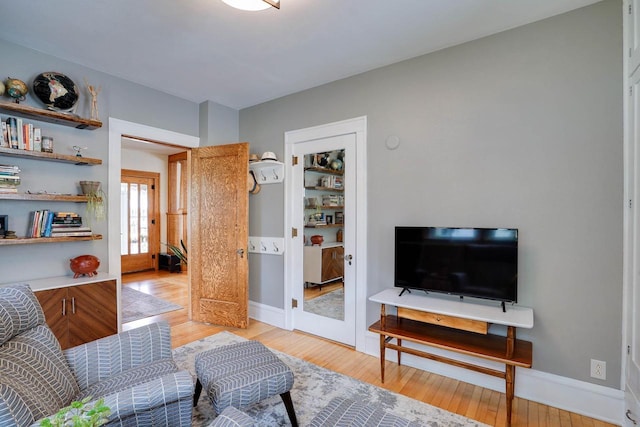 350 Washington St, Prairie Du Sac, WI 53578 - living room with light wood-style floors, baseboards, and french doors