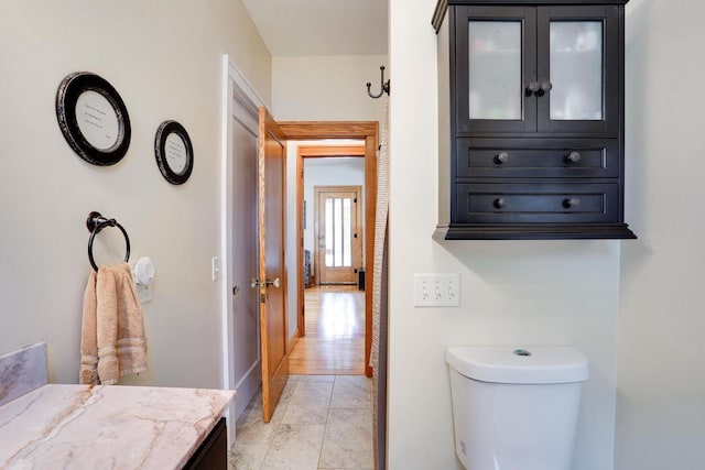 350 Washington St, Prairie Du Sac, WI 53578 - bathroom featuring toilet, vanity, and baseboards