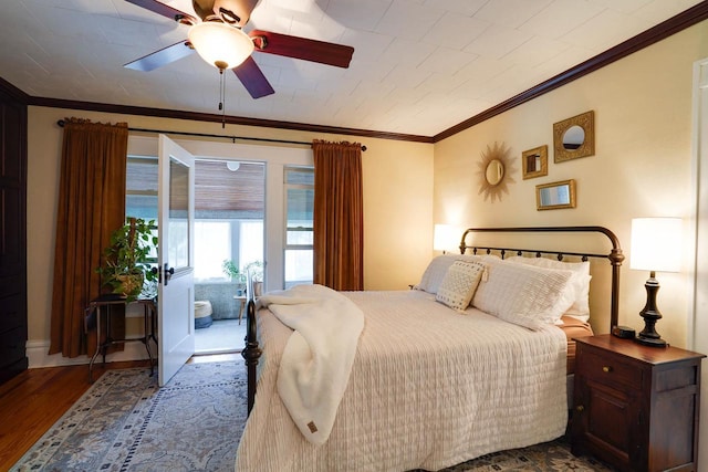350 Washington St, Prairie Du Sac, WI 53578 - bedroom featuring ornamental molding, wood finished floors, access to exterior, a ceiling fan, and baseboards