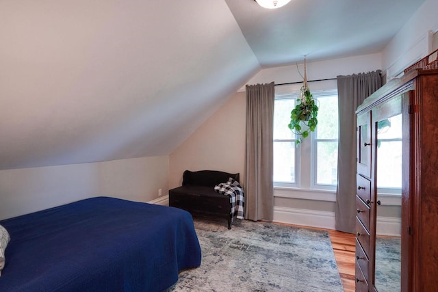 350 Washington St, Prairie Du Sac, WI 53578 - bedroom featuring vaulted ceiling and light wood-type flooring