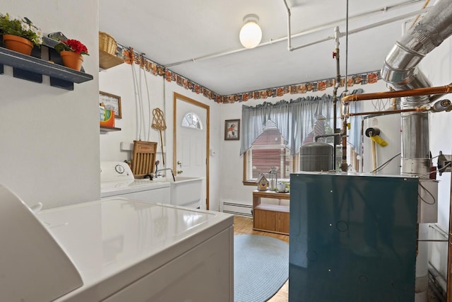 W156N8813 Pilgrim Rd, Menomonee Falls, WI 53051 - washroom featuring a baseboard radiator and independent washer and dryer