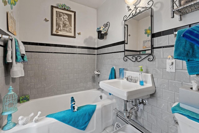 W156N8813 Pilgrim Rd, Menomonee Falls, WI 53051 - full bathroom with tile walls, a bath, toilet, and a wainscoted wall