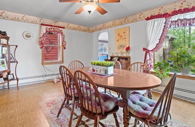 W156N8813 Pilgrim Rd, Menomonee Falls, WI 53051 - dining room with arched walkways, a ceiling fan, and baseboard heating
