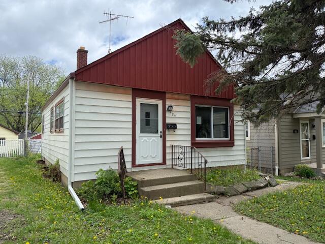 424 S 66th St, Milwaukee, WI 53214 - bungalow-style home featuring a chimney and board and batten siding
