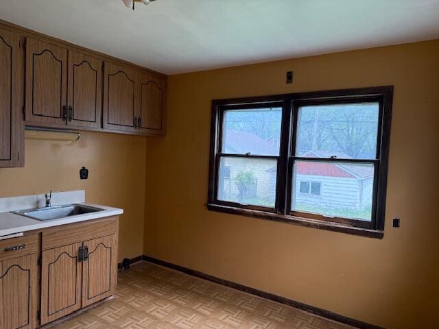 424 S 66th St, Milwaukee, WI 53214 - washroom featuring a sink and baseboards