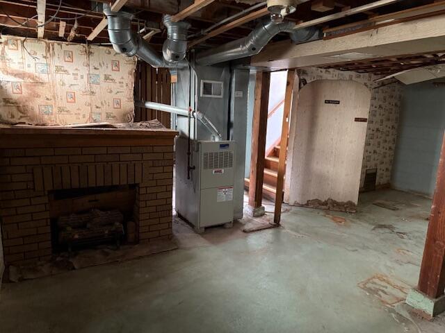 424 S 66th St, Milwaukee, WI 53214 - unfinished basement featuring heating unit and a brick fireplace