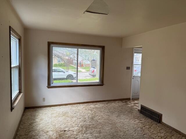 424 S 66th St, Milwaukee, WI 53214 - spare room featuring plenty of natural light, carpet, and baseboards