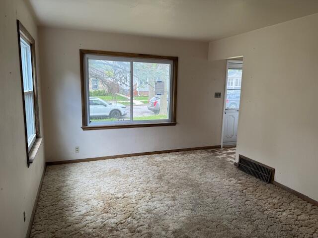 424 S 66th St, Milwaukee, WI 53214 - unfurnished room featuring plenty of natural light, carpet floors, and baseboards
