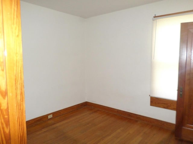 1909 91st St, Pleasant Prairie, WI 53158 - spare room featuring wood finished floors and baseboards