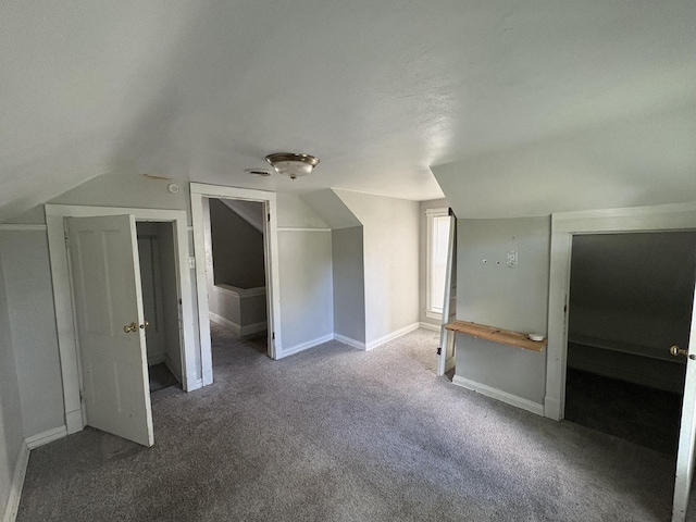 41 E 9th St, Fond Du Lac, WI 54935 - additional living space with carpet floors, lofted ceiling, and baseboards