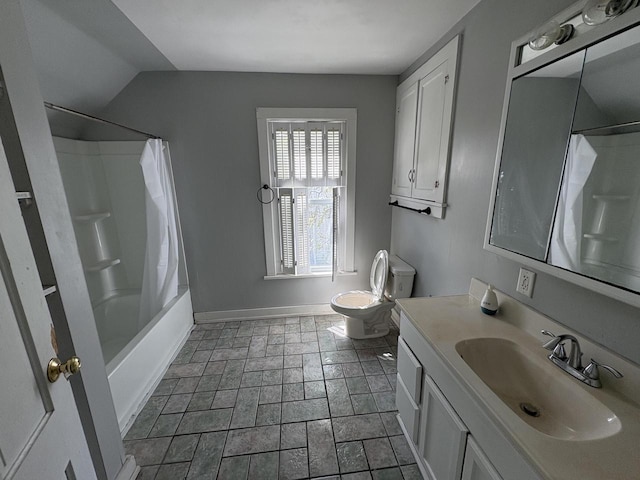 41 E 9th St, Fond Du Lac, WI 54935 - full bathroom featuring toilet, vanity, baseboards, shower / tub combo, and stone finish floors
