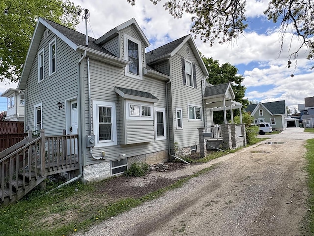 41 E 9th St, Fond Du Lac, WI 54935 - view of property exterior featuring a shingled roof