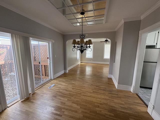 41 E 9th St, Fond Du Lac, WI 54935 - unfurnished dining area featuring a chandelier, wood finished floors, baseboards, plenty of natural light, and crown molding