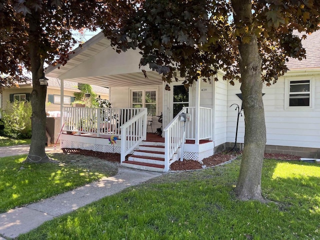 429 Pine St, Tomah, WI 54660 - view of front of home featuring a front yard and a deck