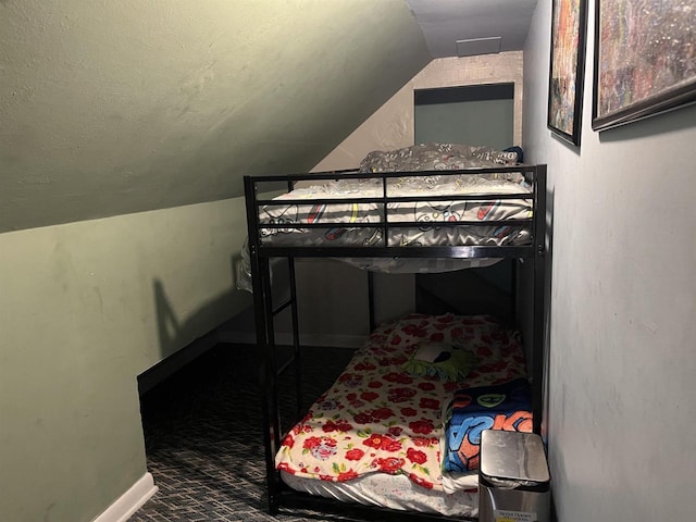 429 Pine St, Tomah, WI 54660 - bedroom featuring lofted ceiling and baseboards