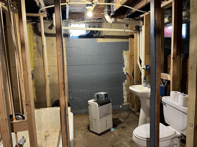 429 Pine St, Tomah, WI 54660 - bathroom featuring toilet and unfinished concrete floors