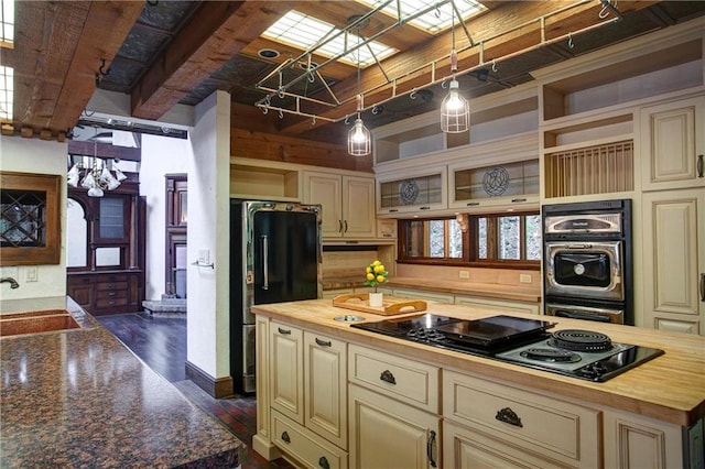 16680W Raining Tree Rd, Stone Lake, WI 54876 - kitchen featuring cream cabinets, butcher block counters, and a sink