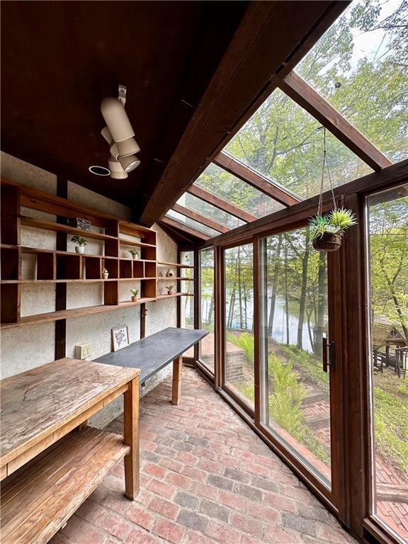 16680W Raining Tree Rd, Stone Lake, WI 54876 - unfurnished sunroom with lofted ceiling