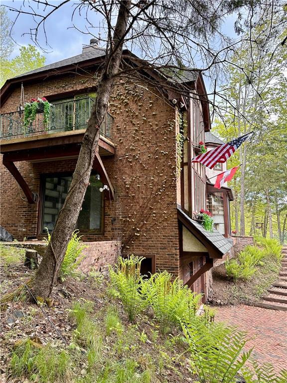 16680W Raining Tree Rd, Stone Lake, WI 54876 - view of home's exterior with brick siding