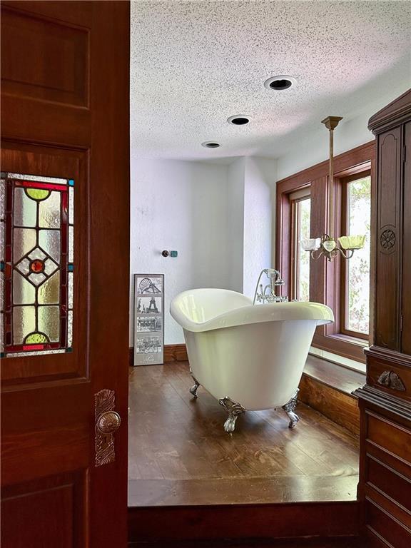16680W Raining Tree Rd, Stone Lake, WI 54876 - entryway featuring a textured ceiling and baseboards