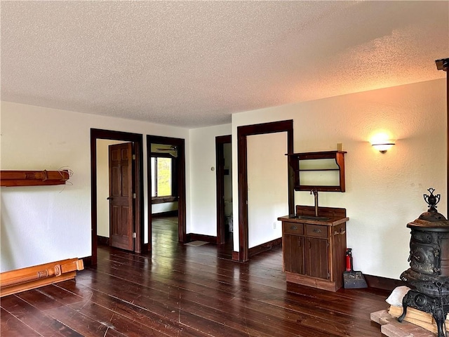 16680W Raining Tree Rd, Stone Lake, WI 54876 - living area with a textured ceiling, wood finished floors, and baseboards