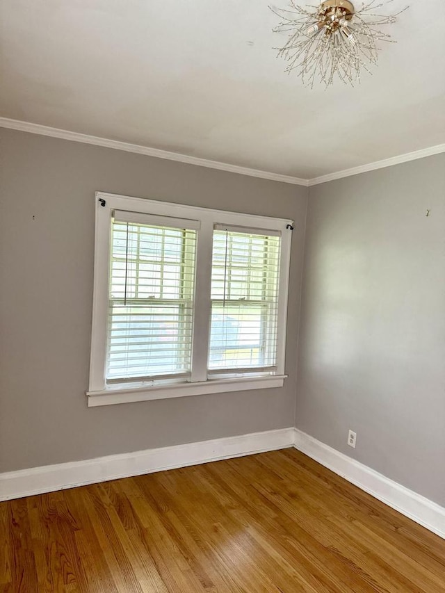 4717 N 19th St, Milwaukee, WI 53209 - spare room with plenty of natural light, baseboards, crown molding, and wood finished floors