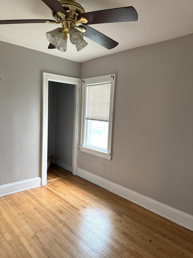 4717 N 19th St, Milwaukee, WI 53209 - empty room with light wood finished floors, baseboards, and a ceiling fan