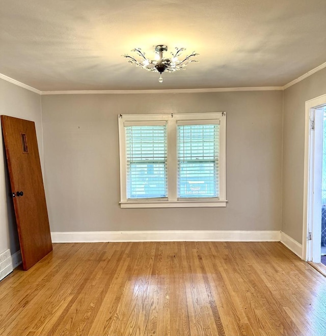 4717 N 19th St, Milwaukee, WI 53209 - unfurnished room with wood finished floors, baseboards, and crown molding