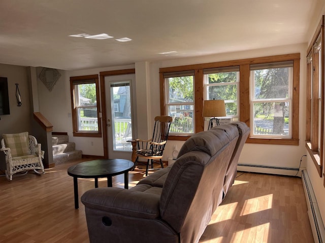 4512 Larson St, Mcfarland, WI 53558 - living room with a baseboard radiator, wood finished floors, and stairs