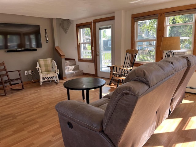 4512 Larson St, Mcfarland, WI 53558 - living room featuring healthy amount of natural light, light wood-style flooring, and stairway