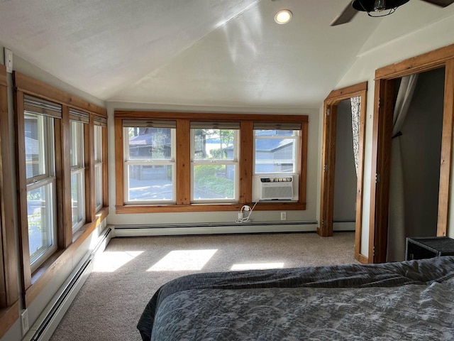 4512 Larson St, Mcfarland, WI 53558 - carpeted bedroom with vaulted ceiling, multiple windows, cooling unit, and a baseboard heating unit