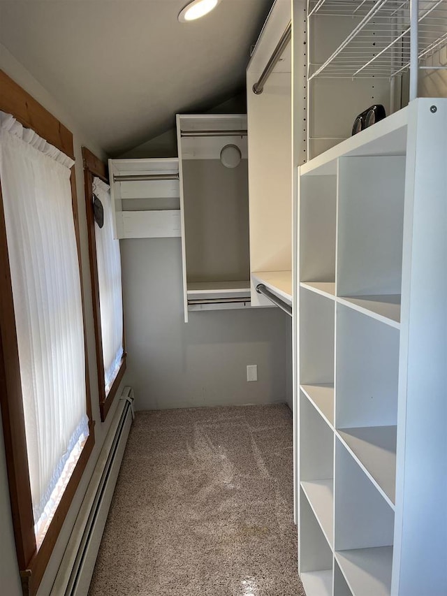 4512 Larson St, Mcfarland, WI 53558 - spacious closet with a baseboard radiator, lofted ceiling, and carpet