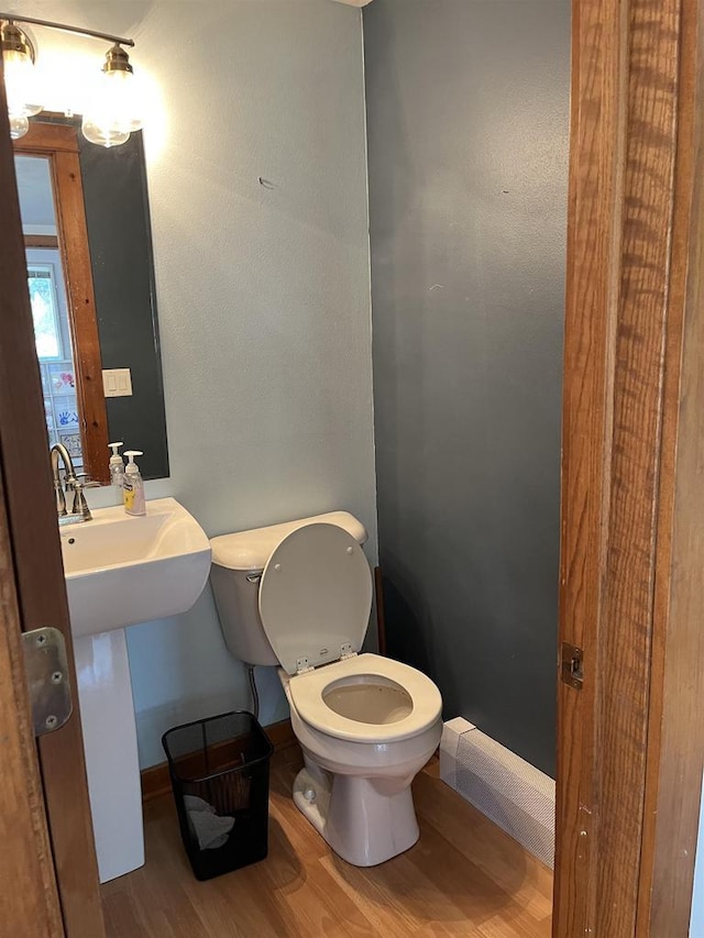 4512 Larson St, Mcfarland, WI 53558 - bathroom featuring wood finished floors, toilet, and baseboards