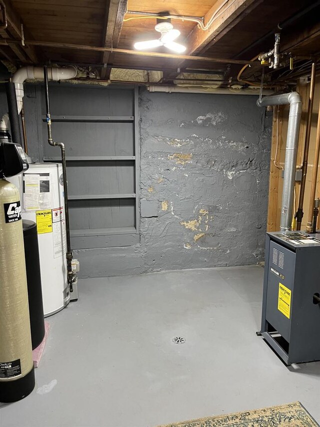 4512 Larson St, Mcfarland, WI 53558 - unfinished below grade area with a water softener system and gas water heater