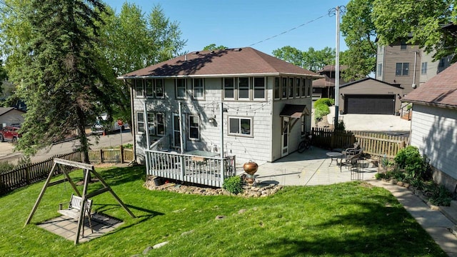 4512 Larson St, Mcfarland, WI 53558 - rear view of property featuring a patio area, roof with shingles, and a detached garage