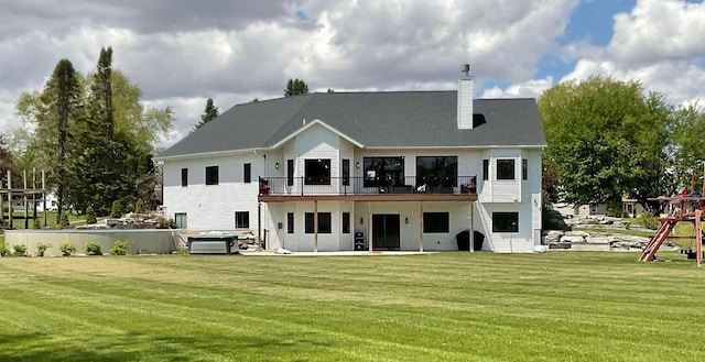 W10559 Hickory Point Rd, Beaver Dam, WI 53916 - rear view of house with a yard, a chimney, and a balcony