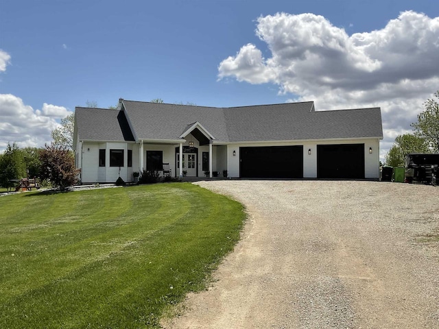 W10559 Hickory Point Rd, Beaver Dam, WI 53916 - view of front of house featuring an attached garage, dirt driveway, and a front lawn