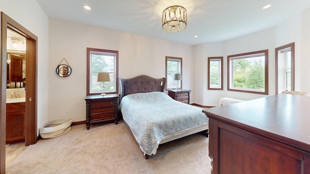 W10559 Hickory Point Rd, Beaver Dam, WI 53916 - bedroom featuring multiple windows, a chandelier, recessed lighting, baseboards, and light colored carpet