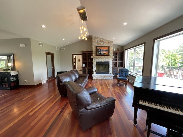 W10559 Hickory Point Rd, Beaver Dam, WI 53916 - living room featuring a fireplace, wood finished floors, vaulted ceiling, baseboards, and a chandelier