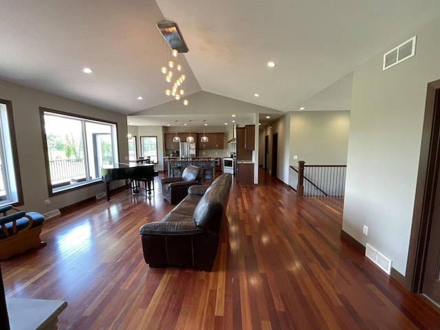W10559 Hickory Point Rd, Beaver Dam, WI 53916 - living area featuring vaulted ceiling, dark wood-style floors, recessed lighting, and baseboards