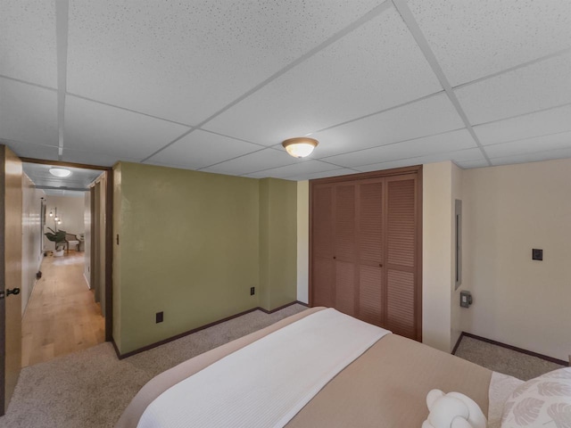 13511 59th St S, Wisconsin Rapids, WI 54494 - bedroom featuring a paneled ceiling, carpet flooring, a closet, and baseboards
