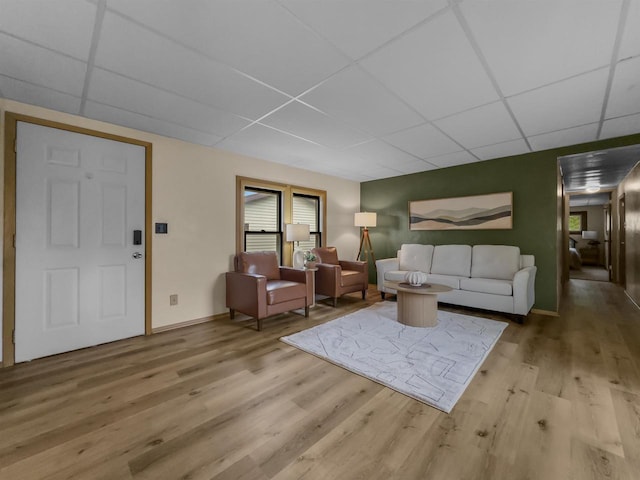 13511 59th St S, Wisconsin Rapids, WI 54494 - living area featuring a paneled ceiling, wood finished floors, and baseboards