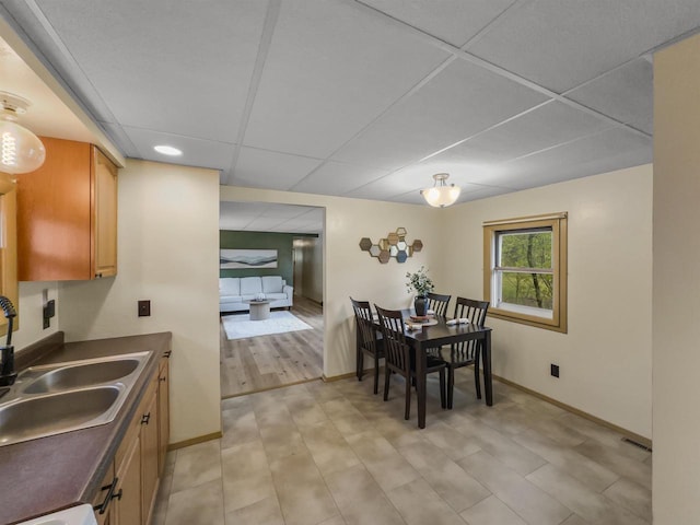 13511 59th St S, Wisconsin Rapids, WI 54494 - dining room featuring a drop ceiling, baseboards, and recessed lighting