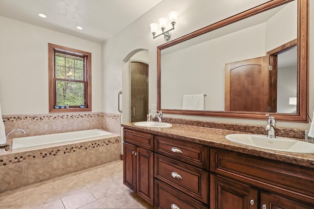 6383 Northwestern Dr, Rhinelander, WI 54501 - bathroom with double vanity, a garden tub, and tile patterned flooring