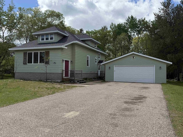 3400 Vine St, Stevens Point, WI 54481 - view of front of home with an outbuilding, a garage, and a front lawn