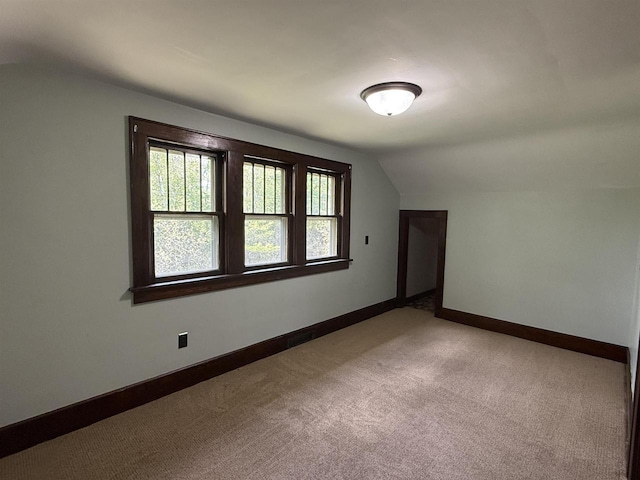 3400 Vine St, Stevens Point, WI 54481 - bonus room featuring vaulted ceiling, light carpet, and baseboards