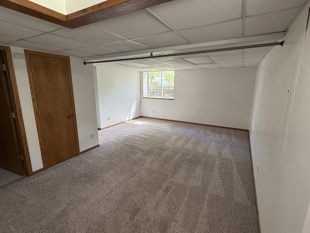 3400 Vine St, Stevens Point, WI 54481 - spare room featuring carpet flooring, a paneled ceiling, and baseboards