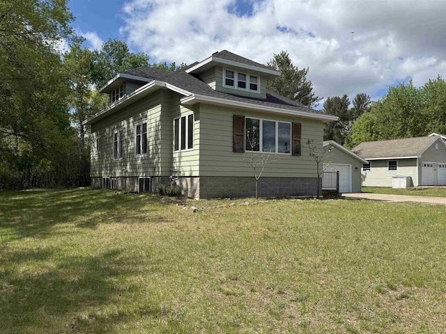 3400 Vine St, Stevens Point, WI 54481 - bungalow featuring a garage, a front lawn, and an outdoor structure